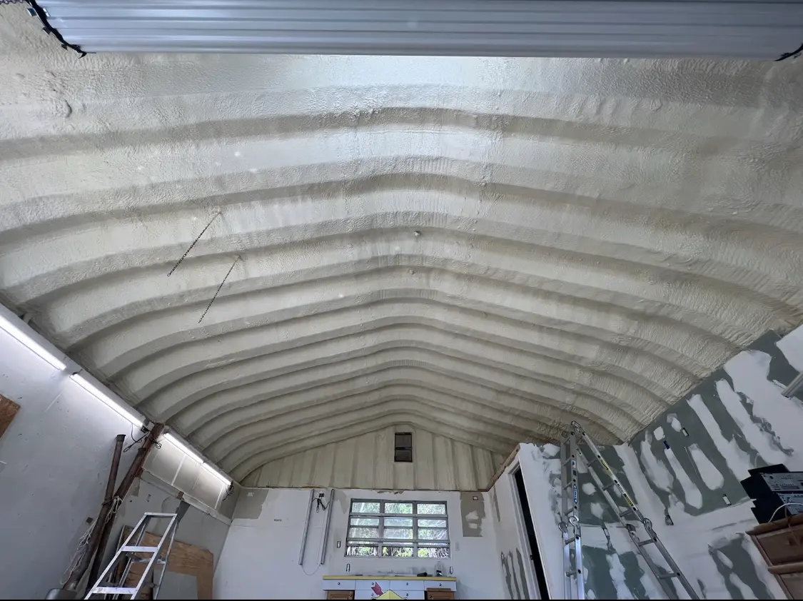 Spray polyurethane foam applied to the underside of a metal roof deck in Okmulgee